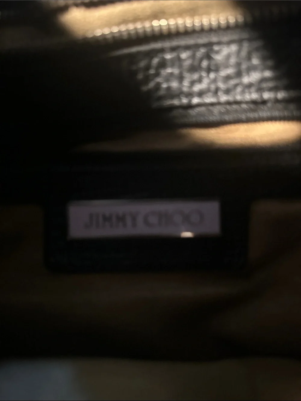 Jimmy Choo Bardia Black Leather Buckle-Accent Hobo Bag with Gold Accents.